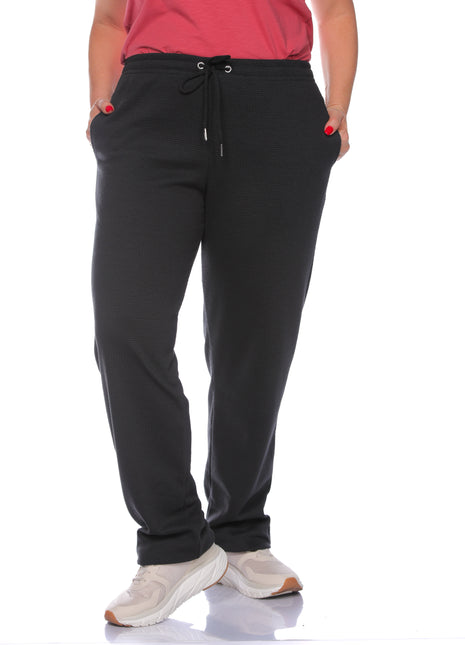 43739B pantalón sudadera silueta amplia, pretina resortada.